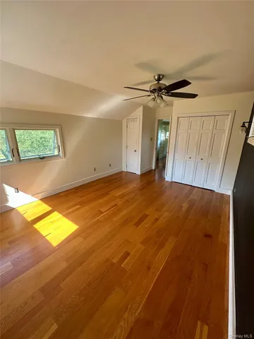 a dining room with furniture a chandelier and window