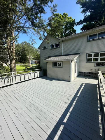 a bathroom with a toilet a sink and a mirror