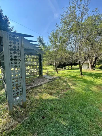 a bathroom with a toilet and a mirror