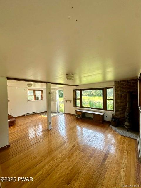 355-359 German Hill Road Shohola, PA 18458 - Photo 30 of 50 Unfurnished living room featuring light wood-style flooring and a baseboard heating unit