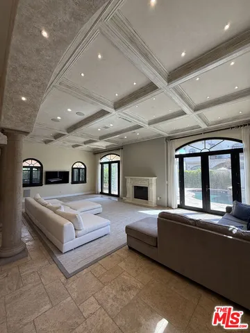 a view of staircase with railing and white walls