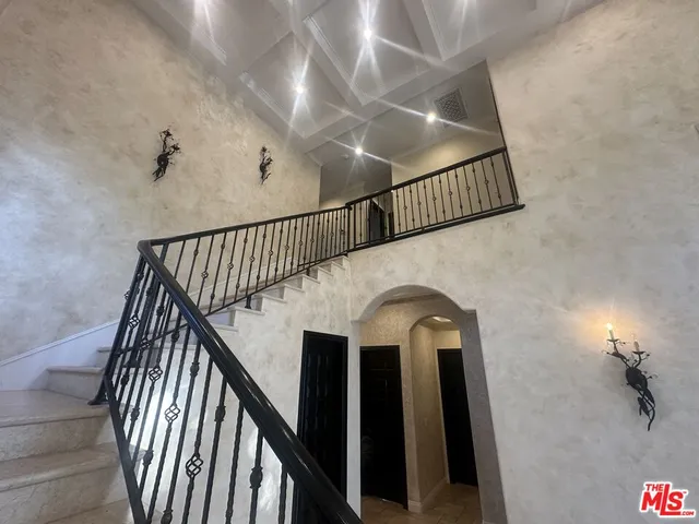 a view of a hallway with a chandelier