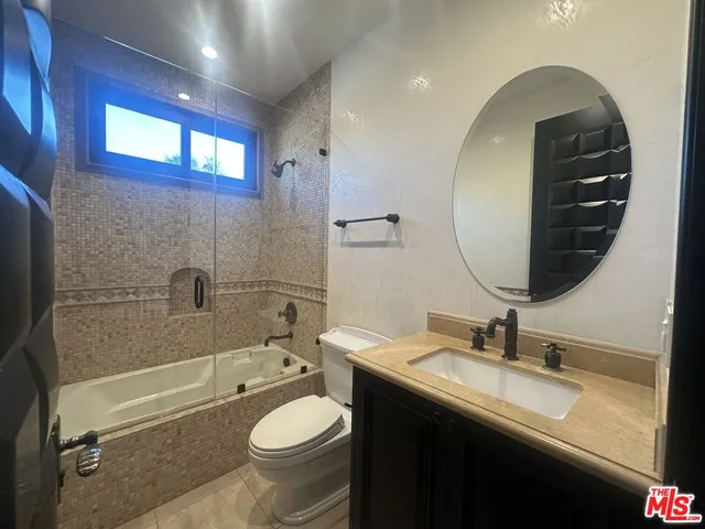 a utility room with sink washer and dryer