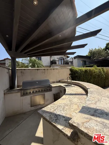 a view of a water fountain and a tree