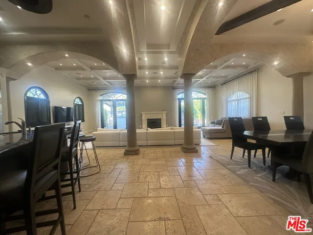 a kitchen with a table and chairs