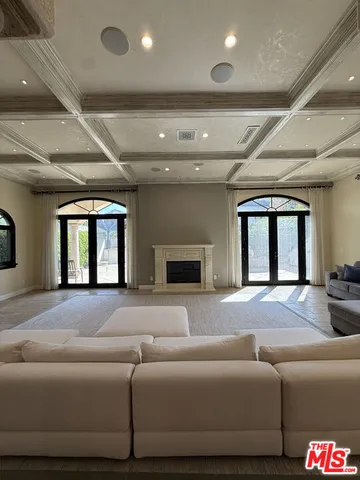 a view of living room with furniture and a flat screen tv