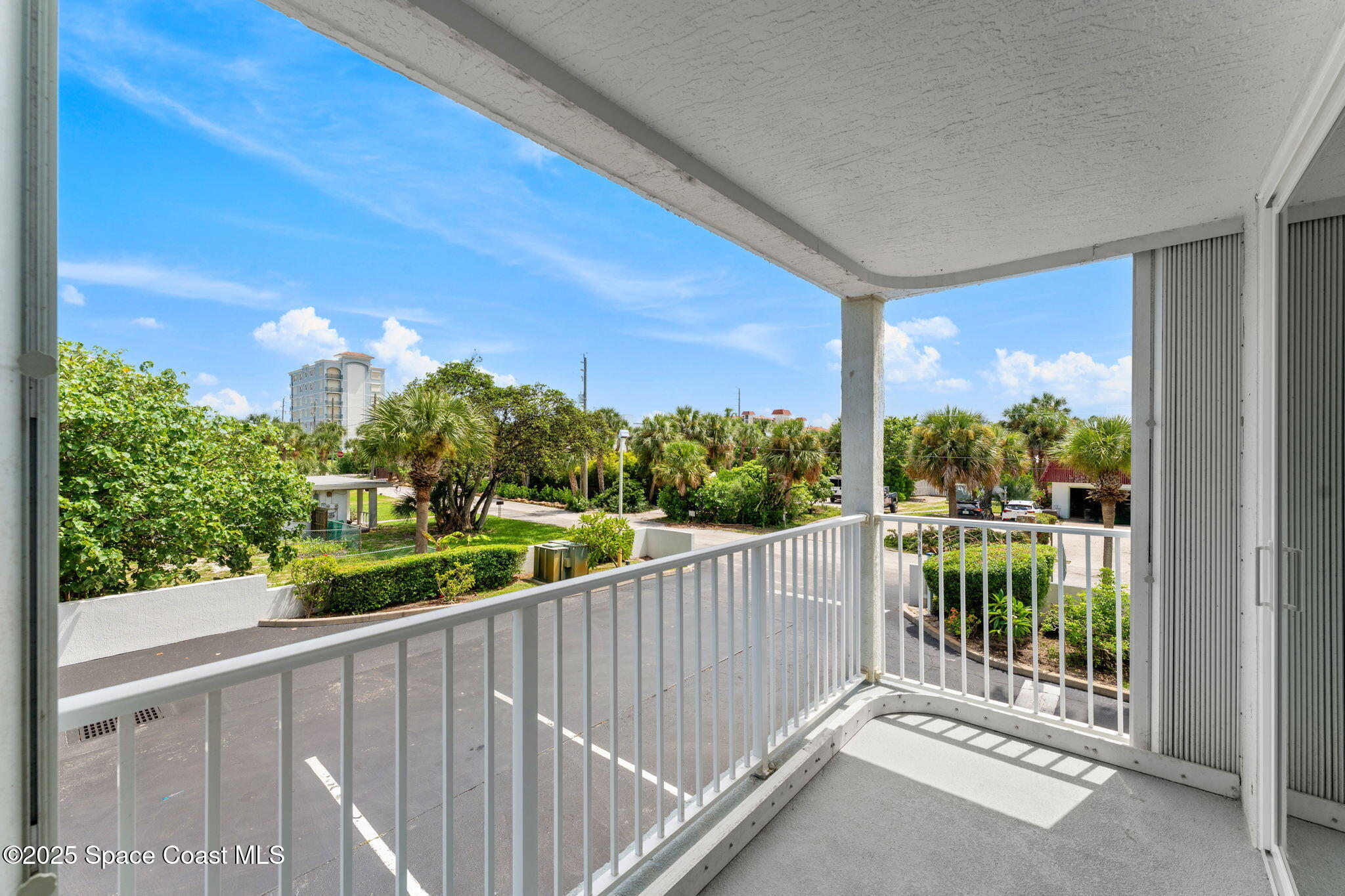 210 24th Street, Unit 201 Cocoa Beach, FL 32931 - Photo 14 of 41 a view of a balcony with an outdoor space