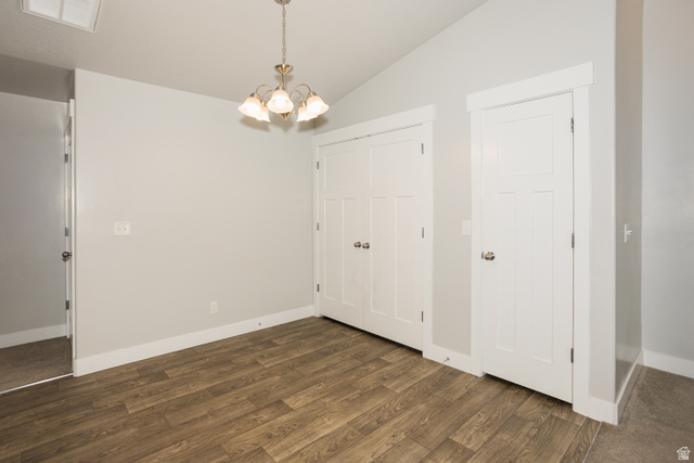 2452 West 500 South, Unit 2 Springville, UT 84663 - Photo 9 of 23 Spacious interior featuring wood-finish flooring, light gray wall paint, a five-bulb chandelier, and white trim throughout
