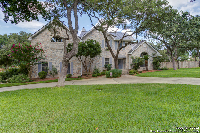 21440 Forest Waters Circle Garden Ridge, TX 78266 - Photo 1 of 1 a front view of house with yard and green space