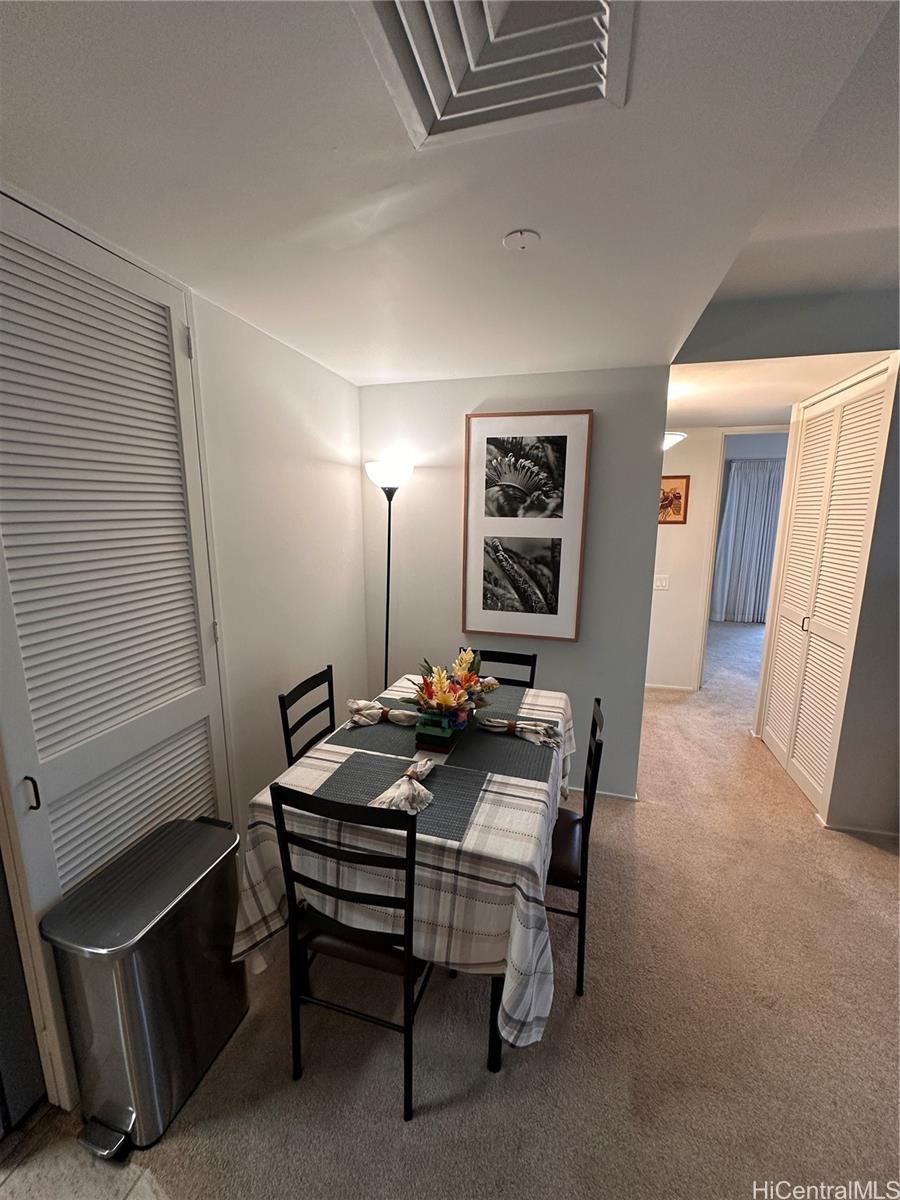 225 Queen Street, Unit 16A Honolulu, HI 96813 - Photo 9 of 16 a table and chairs in a room