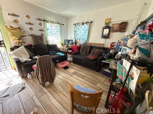 127 East 81st Street Los Angeles, CA 90003 - Photo 18 of 23 a living room with furniture and a flat screen tv