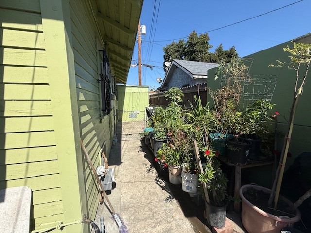 127 East 81st Street Los Angeles, CA 90003 - Photo 20 of 23 a view of a potted flower in the corridor