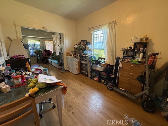 127 East 81st Street Los Angeles, CA 90003 - Photo 5 of 23 a view of a workspace with furniture and a livingroom