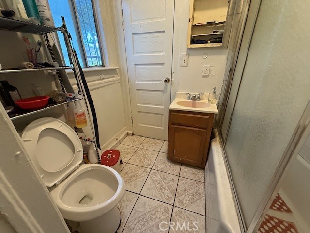 127 East 81st Street Los Angeles, CA 90003 - Photo 8 of 23 a bathroom with a sink a toilet and a mirror