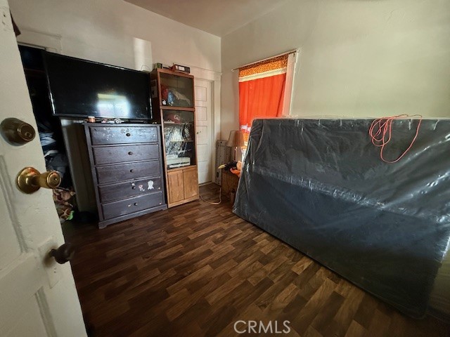 127 East 81st Street Los Angeles, CA 90003 - Photo 9 of 23 a living room with a bed and a television