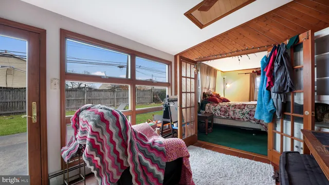 a view of living room kitchen and entryway