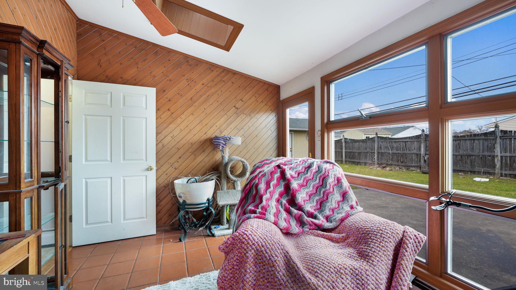 52 Post Lane Levittown, PA 19054 - Photo 13 of 26 a view of a bedroom with a bed and glass door