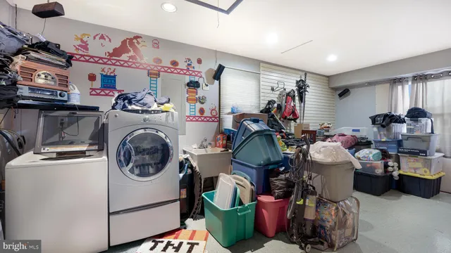 a room with lots of clutter and cabinets