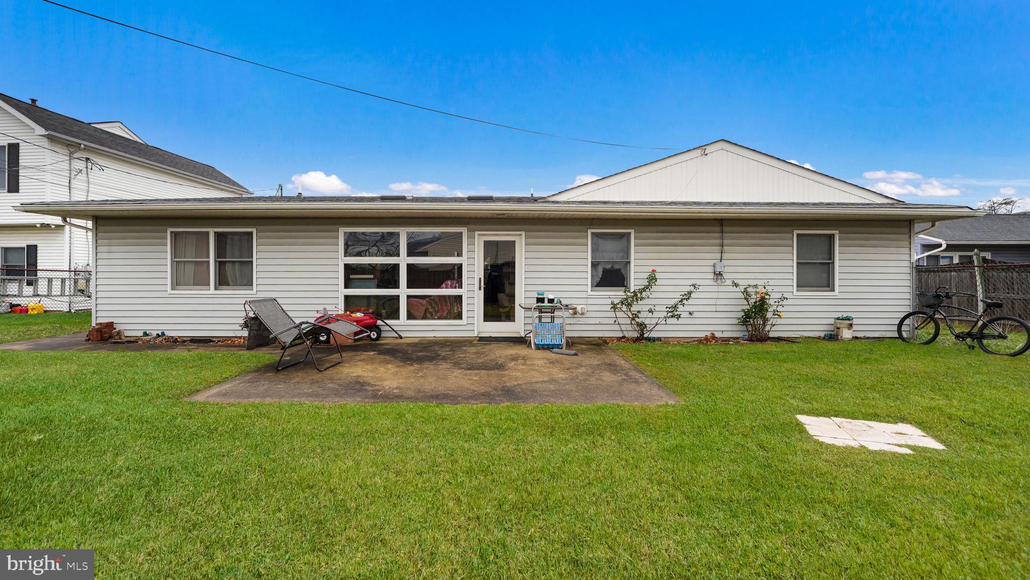 52 Post Lane Levittown, PA 19054 - Photo 20 of 26 a front view of house with yard and outdoor seating