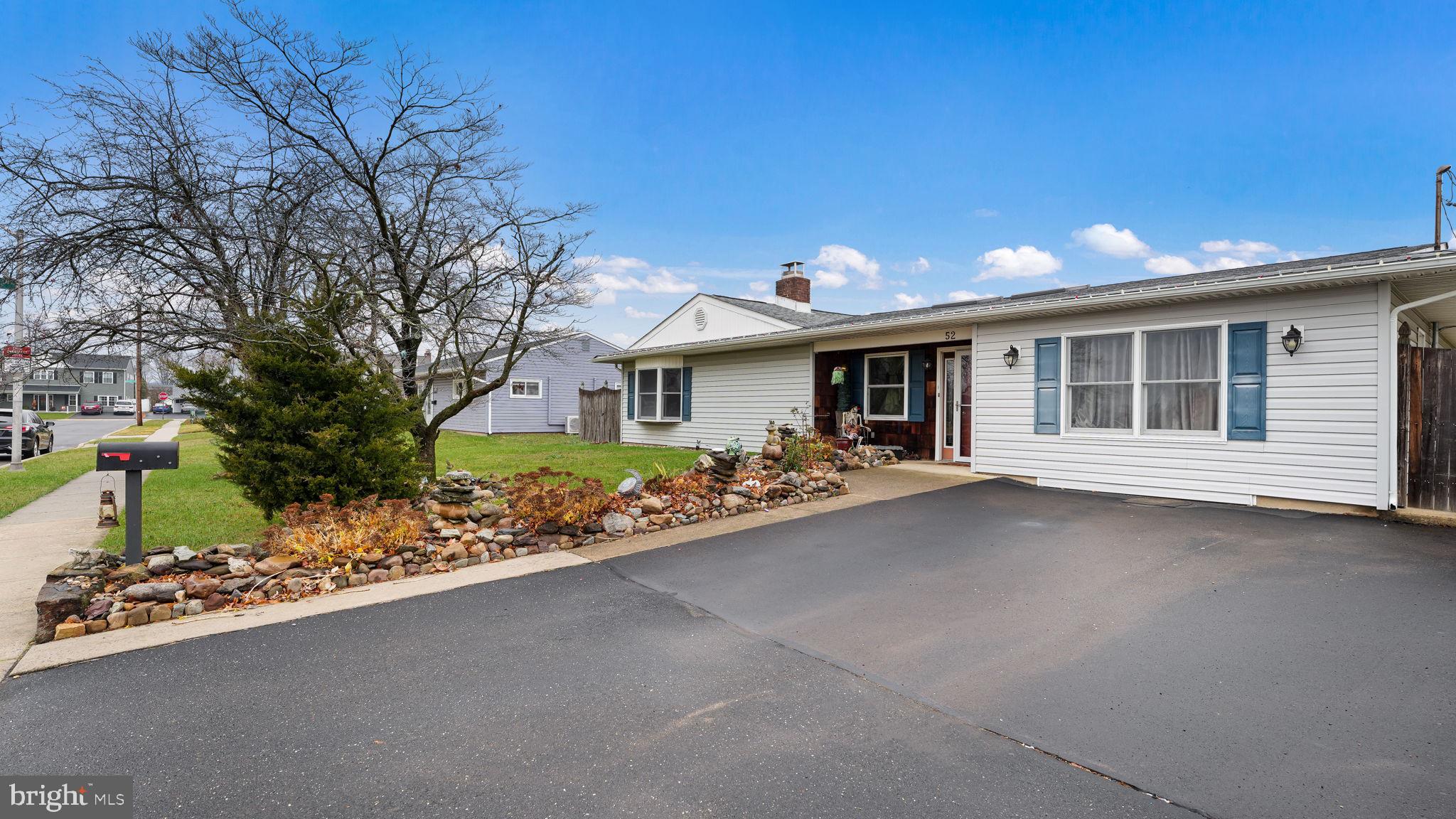 52 Post Lane Levittown, PA 19054 - Photo 2 of 26 a view of a house with a garden and pathway