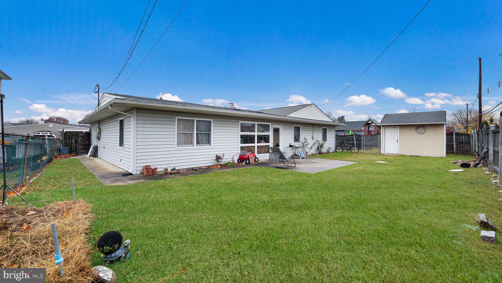 52 Post Lane Levittown, PA 19054 - Photo 21 of 26 a front view of a house with a garden