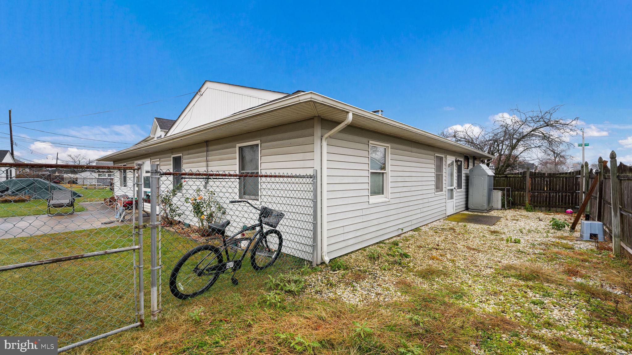 52 Post Lane Levittown, PA 19054 - Photo 23 of 26 a view of a backyard with table and chairs