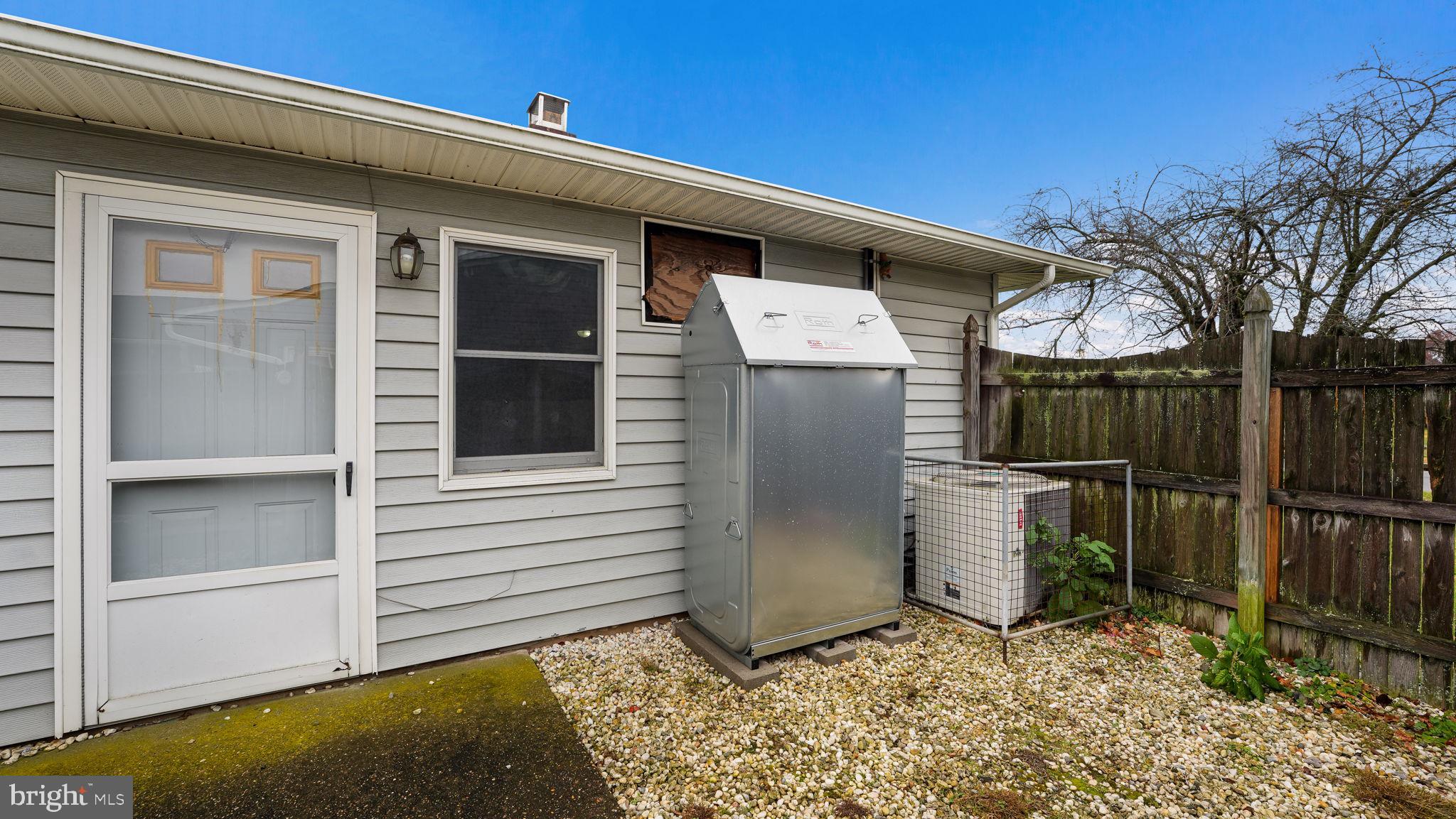 52 Post Lane Levittown, PA 19054 - Photo 24 of 26 a view of a small house with wooden fence