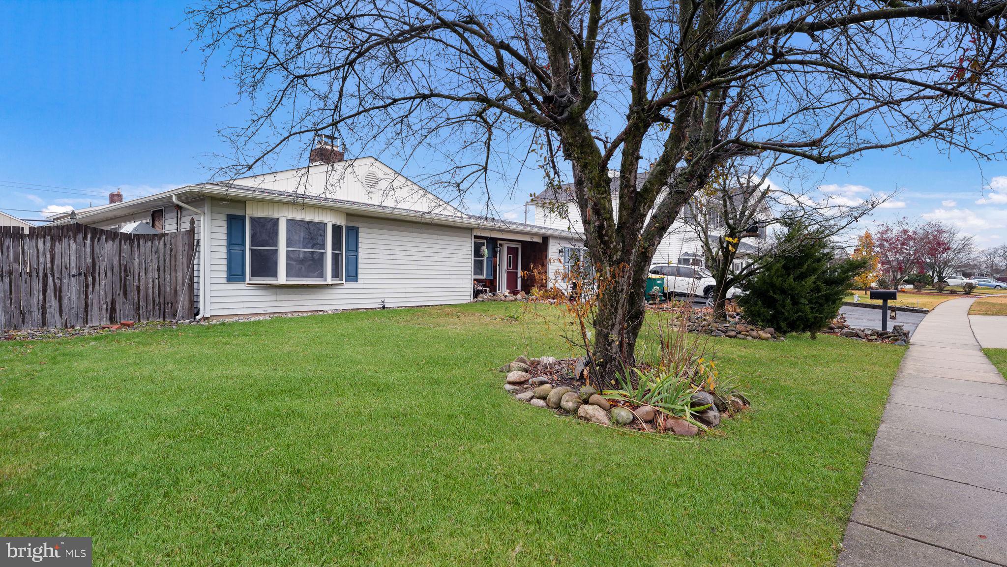 52 Post Lane Levittown, PA 19054 - Photo 26 of 26 a front view of a house with a garden