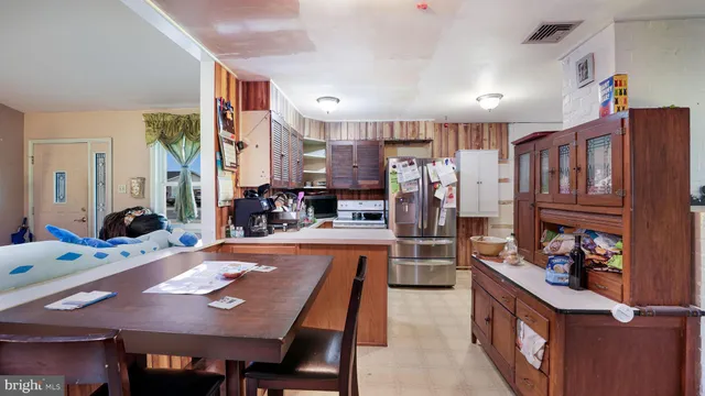a view of a dining room kitchen and a window
