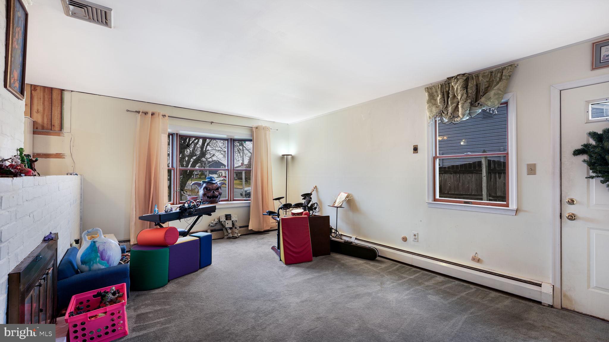 52 Post Lane Levittown, PA 19054 - Photo 7 of 26 a living room with furniture and a window