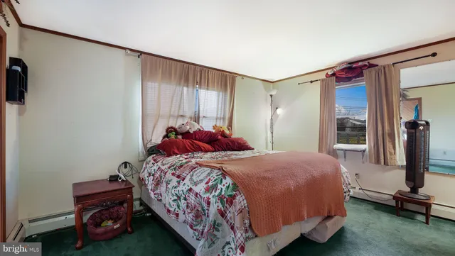 a bed room with a bed and a chair