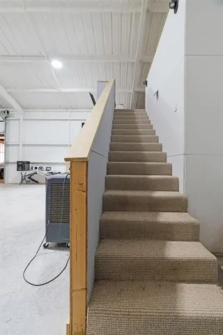 a kitchen with stainless steel appliances a sink dishwasher stove and cabinets