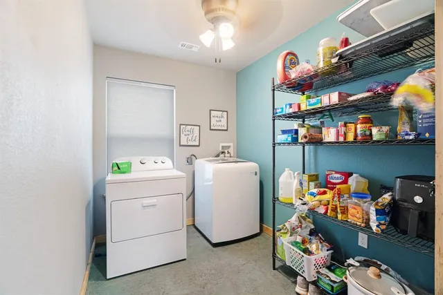a bathroom with a sink vanity mirror and toilet