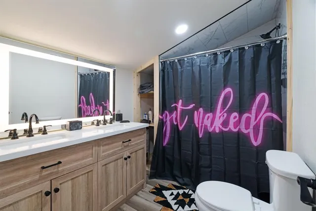 a bedroom with a bed and a television