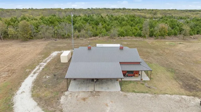 a aerial view of a house with a yard