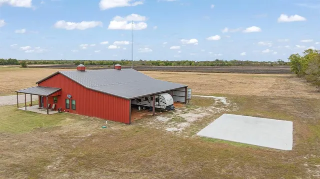 a view of a lake with houses in the back