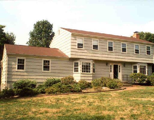 38 Flat Swamp Road Newtown, CT 06470 - Photo 1 of 1 a front view of house with yard and green space