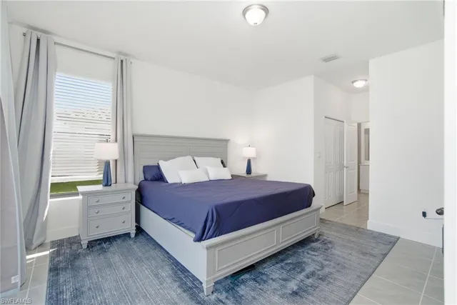 a room with a bed and a window