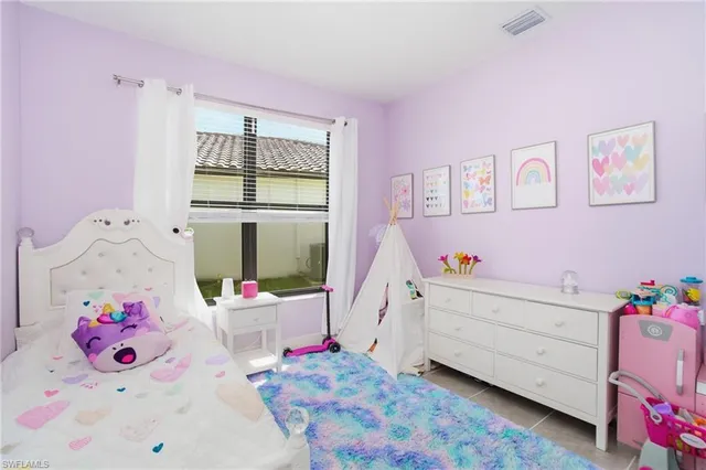 a bed room with a bed and a window