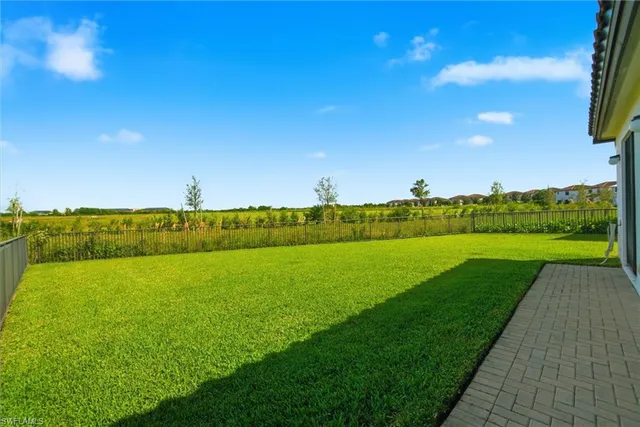a view of a field with an ocean