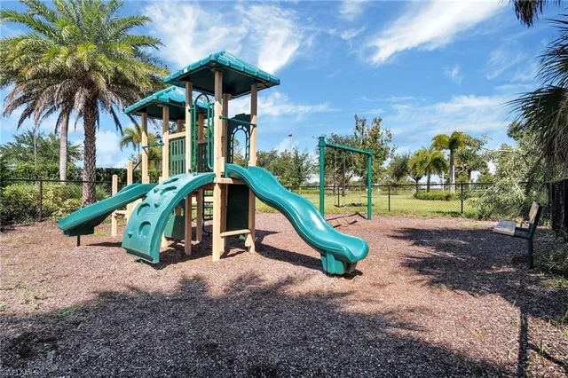 a small garden covered with tall trees