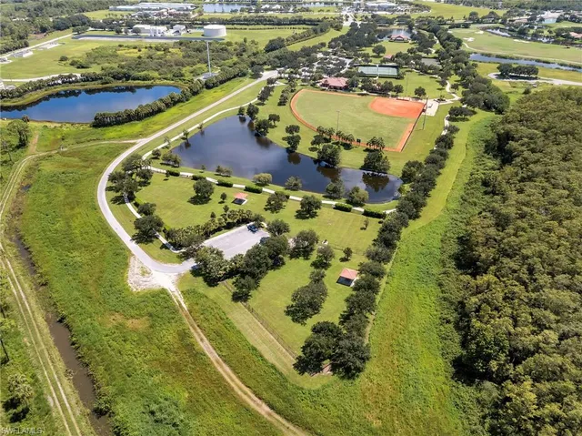 an aerial view of a residential houses with outdoor space