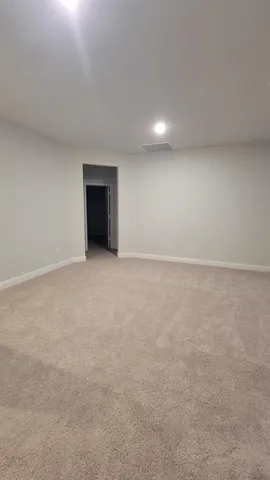 a view of an empty room with a fireplace