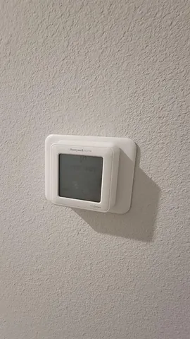 a view of an empty room with a fireplace