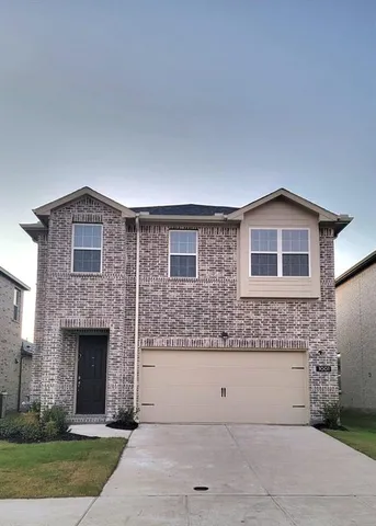 a view of a house with a yard and garage