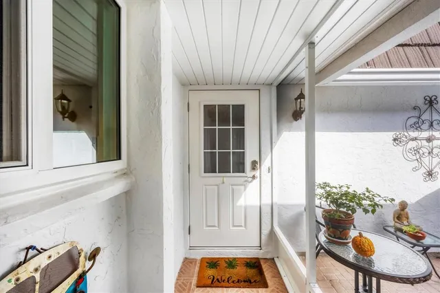 a front view of a house with outdoor seating