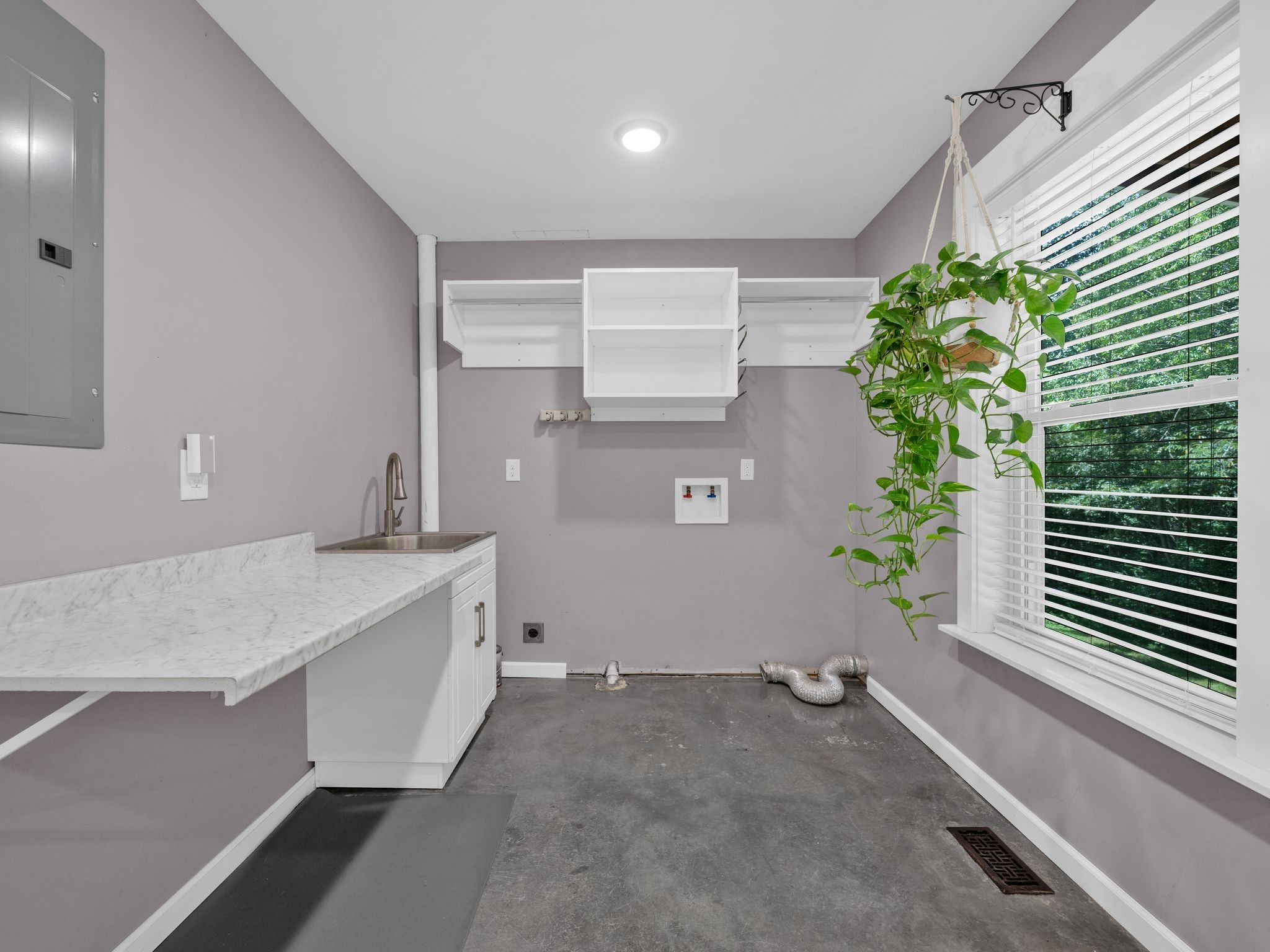 509 Iron Hill Road Burns, TN 37029 - Photo 18 of 40 a room with a potted plant on a counter top and a potted plant