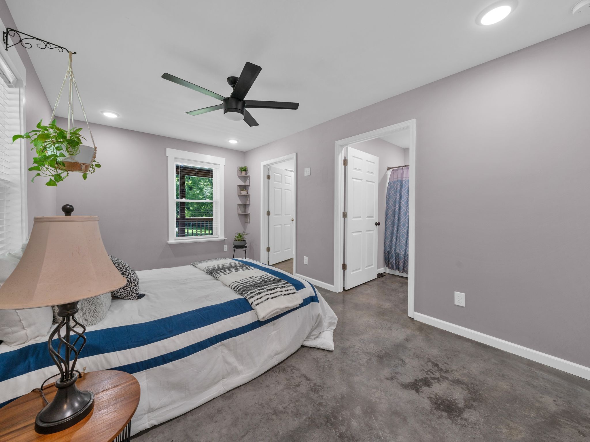 509 Iron Hill Road Burns, TN 37029 - Photo 20 of 40 a spacious bedroom with a bed and a table