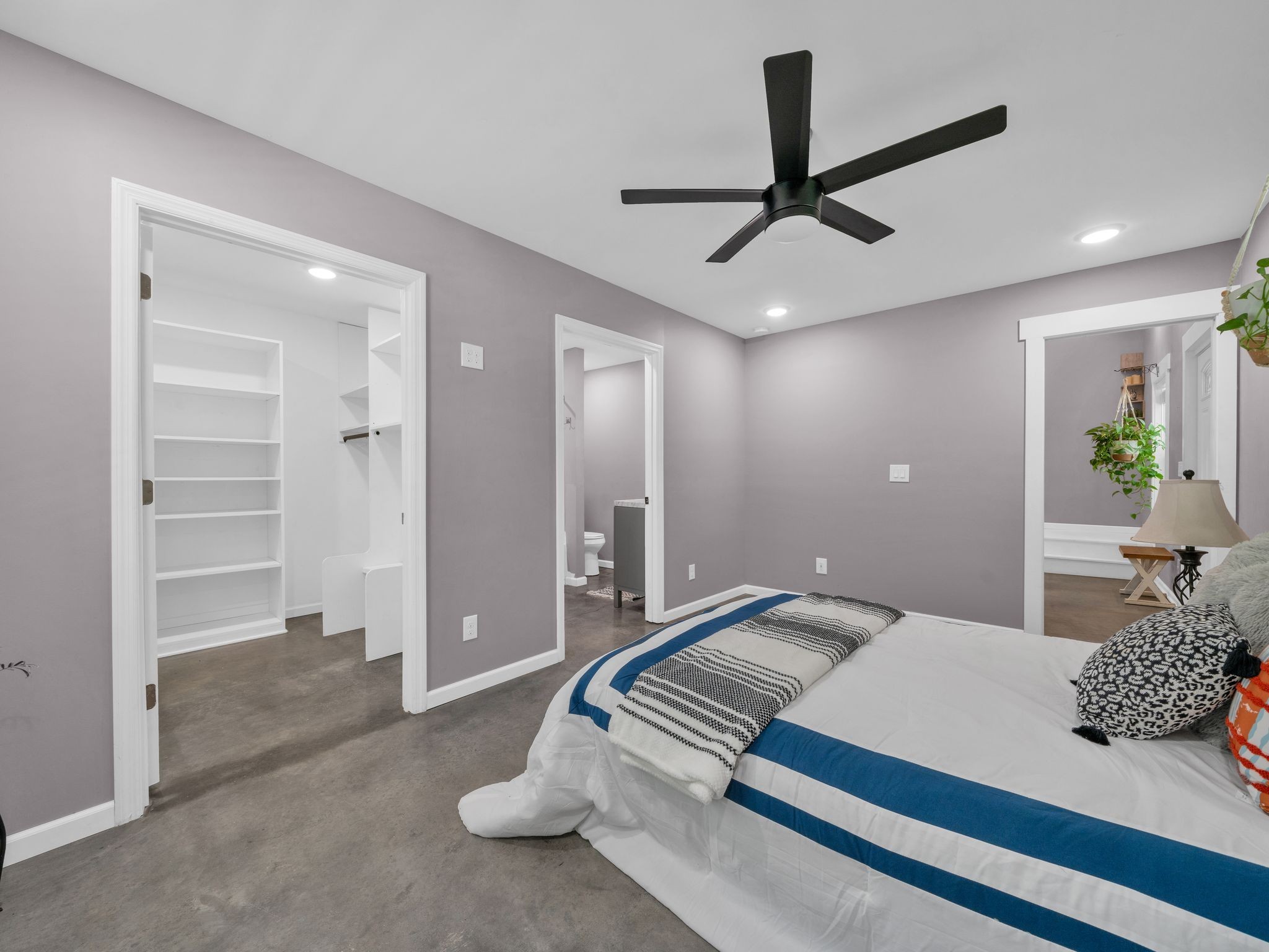 509 Iron Hill Road Burns, TN 37029 - Photo 21 of 40 a bedroom with a large bed and ceiling fan