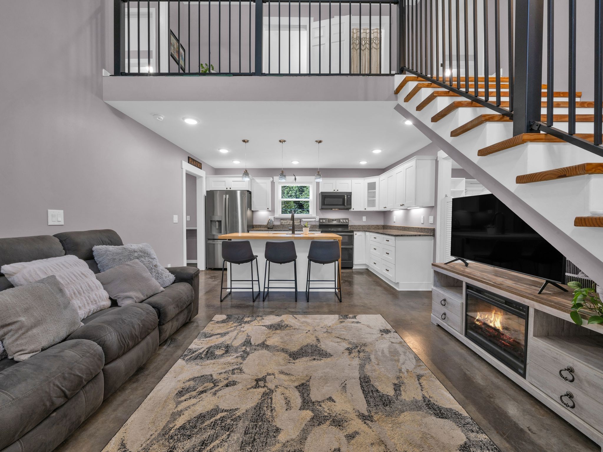 509 Iron Hill Road Burns, TN 37029 - Photo 3 of 40 a living room with a flat screen tv and a fireplace